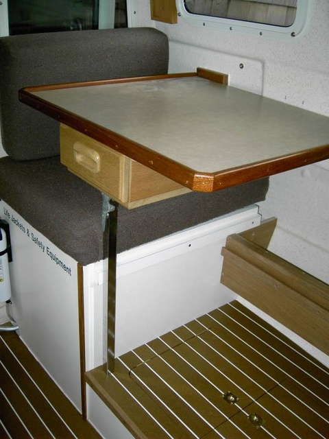 Table in aft position over the top of the rear seat. This setup blocks use of the rear seat when the Barber Chair faces forward.