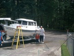 Grandson Aric helping Papa clean up the Mary Ellen.