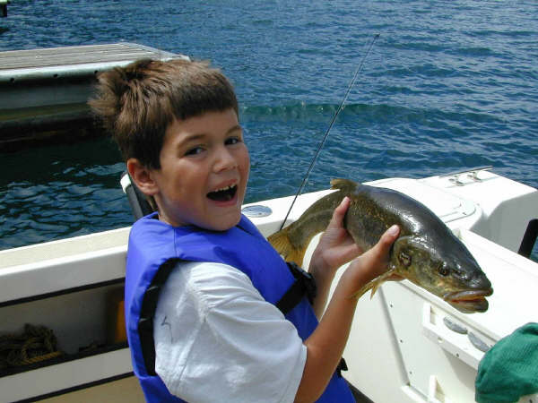 Mason with trophy squaw fish, Lake Chelan, 2003.