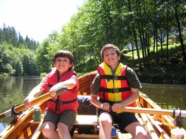 Mason and friend rowing up the slough past Wayne Golf course.