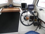 Moved the VHF Radio to lower right of the helm and installed compass in the top center.