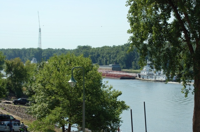 The upbound tow presses against the bank and lets the downbound tow with the right of way squeeze by.