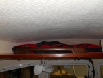 I used an old grab rail from a previous boat, to keep things from tumbling off the upper shelf.