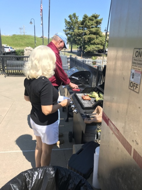 Red and white hots on the grill. Terry and Debby