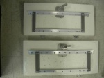 Cockpit hatch modification.  Angle brackets coupled to latch and hinges.  All components corrosion resistant.  Brackets preloaded to bend lid 1/8\