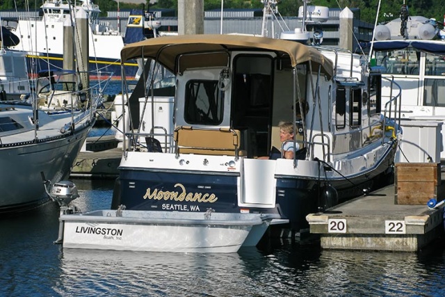 Moondance - dinghy down transom view - note hand winch on port side of cabin door