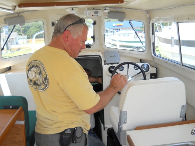 Checking out the new boat to take delivery