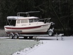 Frosty morning yesterday. New shore power, windlass, and the new artwork showing.