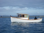 I believe this is an outboard powered vessel, OB in the stern well.  Nice lines, no wake and very clean.  Wooden boat, Port Townsend, WA.