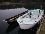 This 19 Bartender was built by George Calkins, original designer of the Bartender in the late 50's.  Found this (white and green) one with the bow nearly submerged, bowdown, and stern in the air, water up to the seat part of the console, tied to a sunken mooring ball one morning in Mystery Bay. (See the 360 tour view below.)