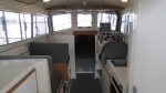 Cabin with table stowed and passenger seats facing forward