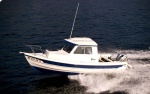 First boat, 2001 CD-16, Used in C-Dory Brochure Photo.  The factory borrowed our boat for their photo shoot. Three subsequent factory owners have used the pictures as well.