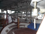 Foredeck with anchor windless, lots of teak, and fog bell.