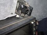 This fan is made from a 12 volt computer fan.  The brackets are from a transom mount transducer. The fan can be rotated to blow on the drivers window, center window or both.