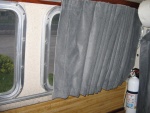 Curtains are made from auto upholstery material.  I wash them in the washing machine, cold water. 