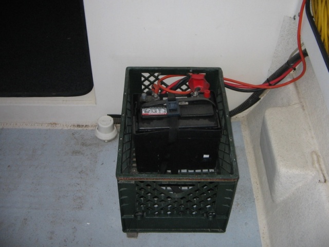 Battery box inside crate.  Shim under inboard side of crate to level.