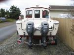 Looking it over, view of twin 40 Yamaha's and trim tabs.