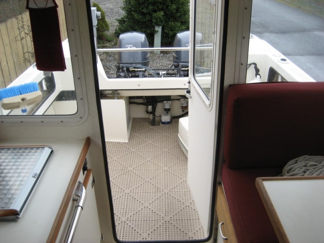 View from cabin to stern.  Wallas to starbd, table on port, porta-pottie hiding to port in cockpit.