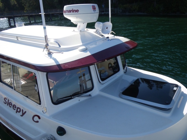 SleepyC external electronics array.  GPS down off the post and onto the brow, the hailer horn glued on, 2 VHF antennas work for 2 VHF's, with AIS receiver and AM/FM too. Forward hatch is up at first notch.  Gets lowered and locked down anytime I go out of Sequim Bay, or out into open water.