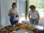 Jackie and Sandra helping setup fruit