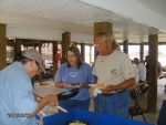 Paula cooking, Carrie and Ashely getting breakfast.