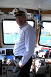 Larry K at the helm of the Huron Lady II