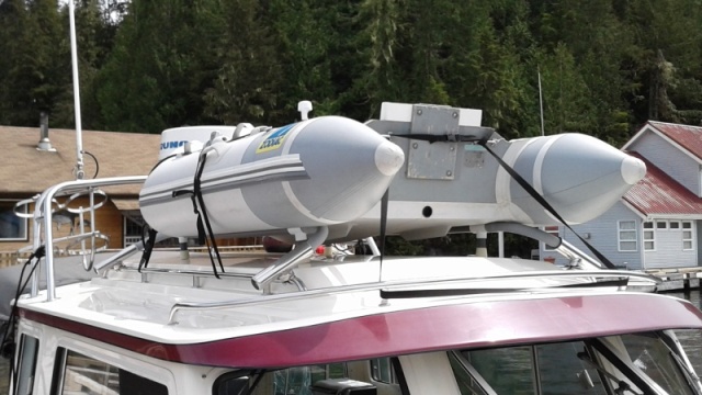 Light weight PVC/Conduit dingy mount is removable, makes mounting easy and keeps tender from scraping your cabin top. 