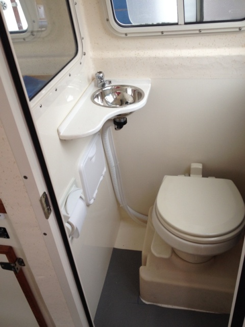 Adding a small sink in Head improves cruising comfort and convenience for crew and really does not cramp Tomcat head