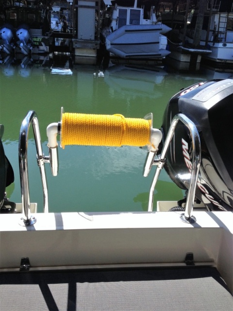Using fishing pole mounts for custom stern Line roller allows you to store roller out of the way when not fishing