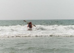 Kathy riding waves at Ocracoke, NC