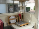 Galley with corner shower caddy, plate holder and paper towel holder.    Note: weve now been using this stainless caddy for ~7 years.  It still looks new with no signs of rust.  Its been a great addition in the galley.  