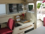 Galley with corner shower caddy, plate holder and paper towel holder and towel rod/handhold