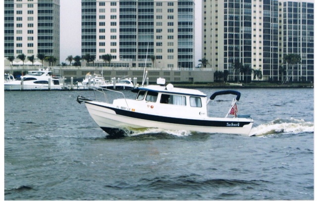 The SusieQ westbound-Fort Myers Yacht Basin in background