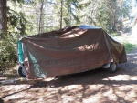 Now the edges hang down evenly to the trailer and are ready for attachment with bungee stoppers.  I'm not worried about a little water dripping through, as there is enough ventilation.  The cover is for protection from pitch, bird poop, leaves, pine needles, etc.