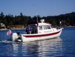 Mac, rigging for fishing on Two Lucky Fish.(Robbi) 