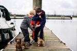 Photo from the Everett Herald.  Dalton, Parker and Logan taking care of the dogs while I am staging the rig on the launch.  A roaming reporter from the Herald happened to take this photo