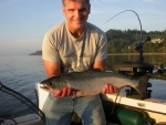 One of two coho caught at the shipreck near picknic pt.  This one was caught close to shore (140' of water) 85' down with uv flasher and white uv squid with hearring strip.  Shipwreck 9/15/2013