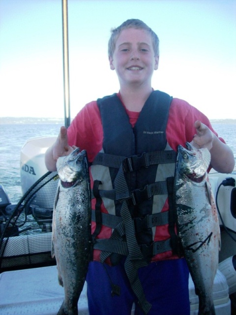 Logan with Jeff Head Silvers

Caught @ 55' with Green glow hootchie and hearing strip.  7/5/2011
