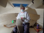 Working on installing the hull liner in the V-berth. 