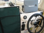 Power switch and volume control for Poly-Planar ME-50 just above trim tab indicator, auxiliary input on top of dash