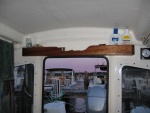 mini shelf above entry hatch for various small things used every day
clock mounted on velcro