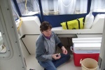 Captain clearing the bilge of water in anticipation of sub-freezing temperatures - (3JAN10)