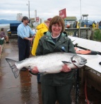 Beth with a Cook Inlet chinook (42 lbs) -- the Duck comes through again