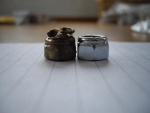 Melted nut on left and new nut on right.JPG