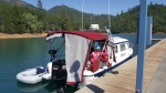 Dana and Sierra on shakedown cruise on lake Shasta, she designed the bimini full enclosure to have either sun/bug screens for Mexico or clear plastic for up north.