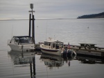 Sequim Bay dock quiet time.  Both boats the same length, not the same size though.