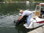 Adjusting trim fin in the water