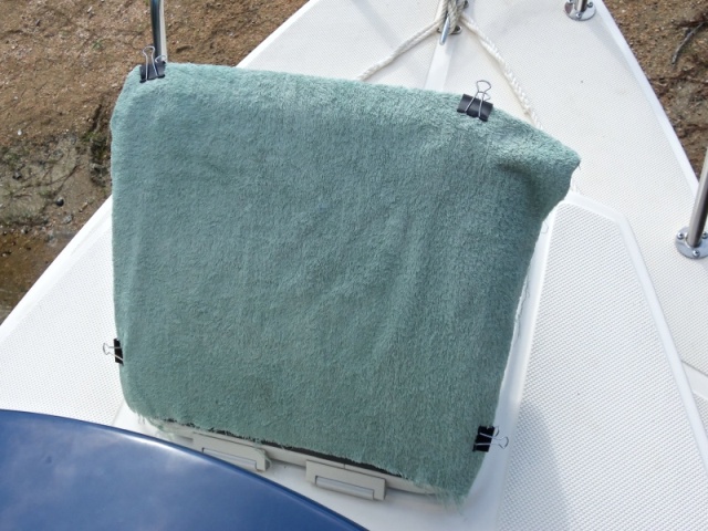 Poor man's sunshade. Towel and four binder clips