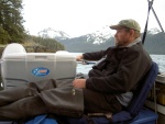 On a rare warm day relaxing on my West Marine chair, which is sitting on the fuel can container