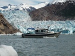 JoLee at the helm cruising through the ice burgs in front of South Sawyer Glacier